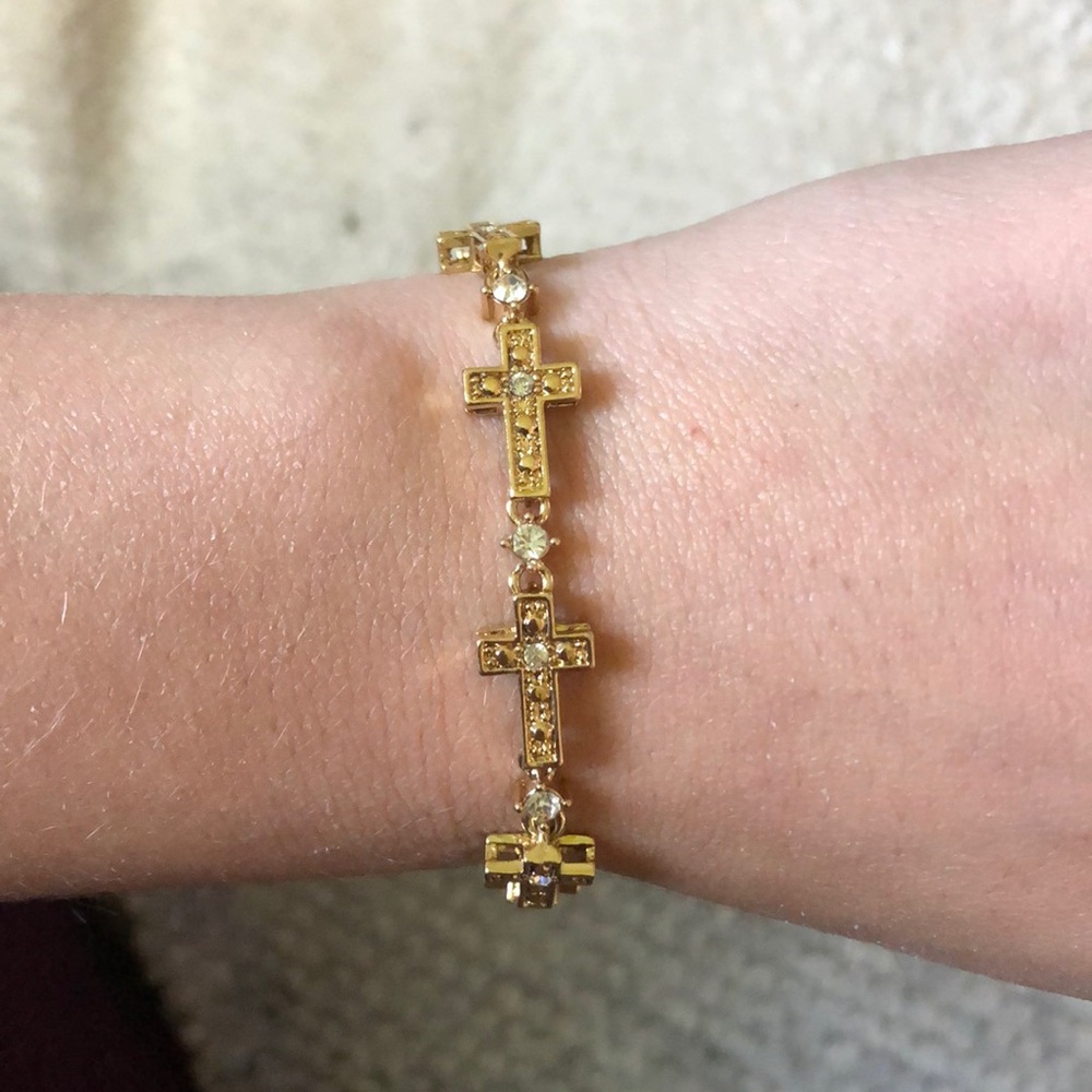 Sparkling cross tennis bracelet gold colored